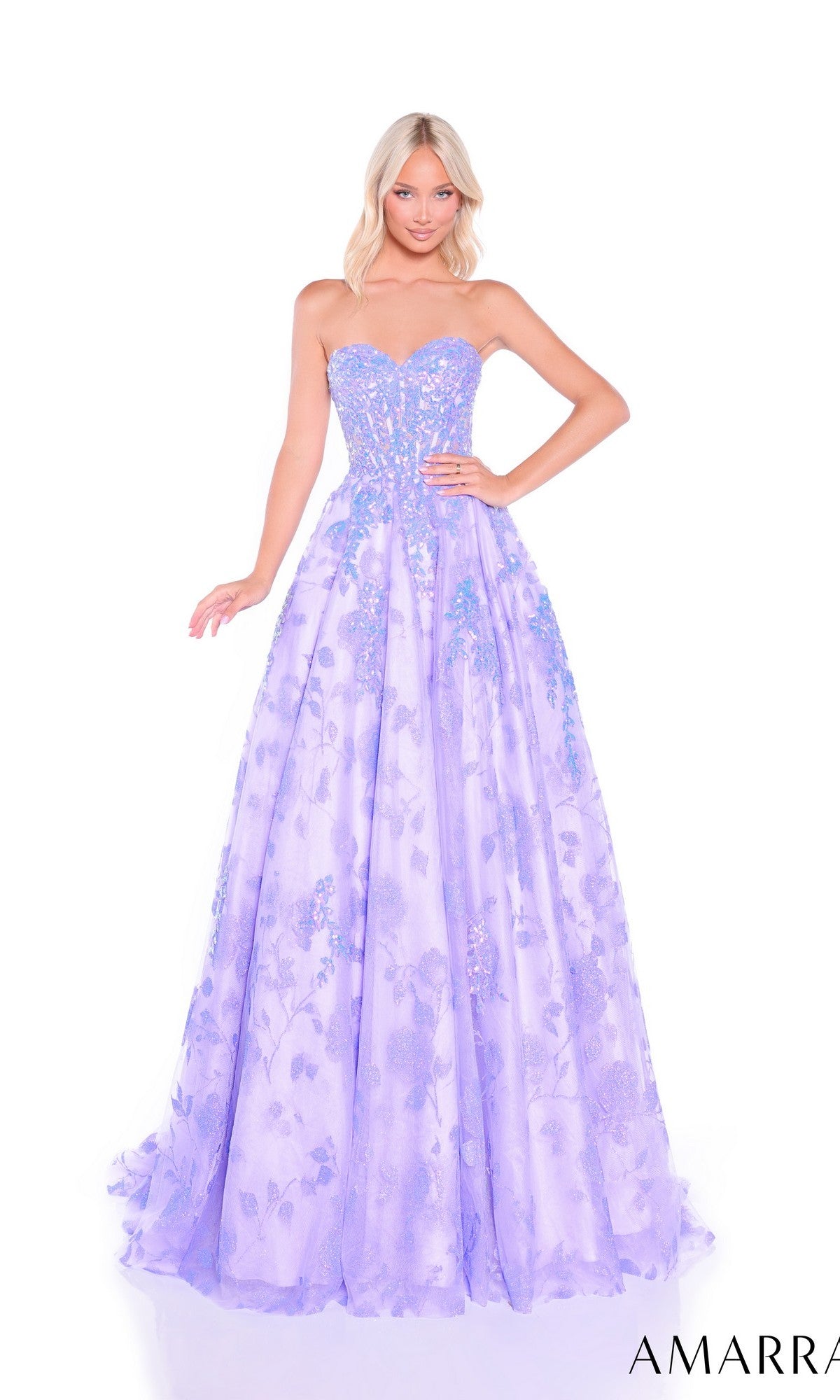 A woman poses against a white background wearing the Amarra 89513 long prom dress—a lavender, strapless gown with floral-embroidered tulle, a fitted bodice, and full skirt.